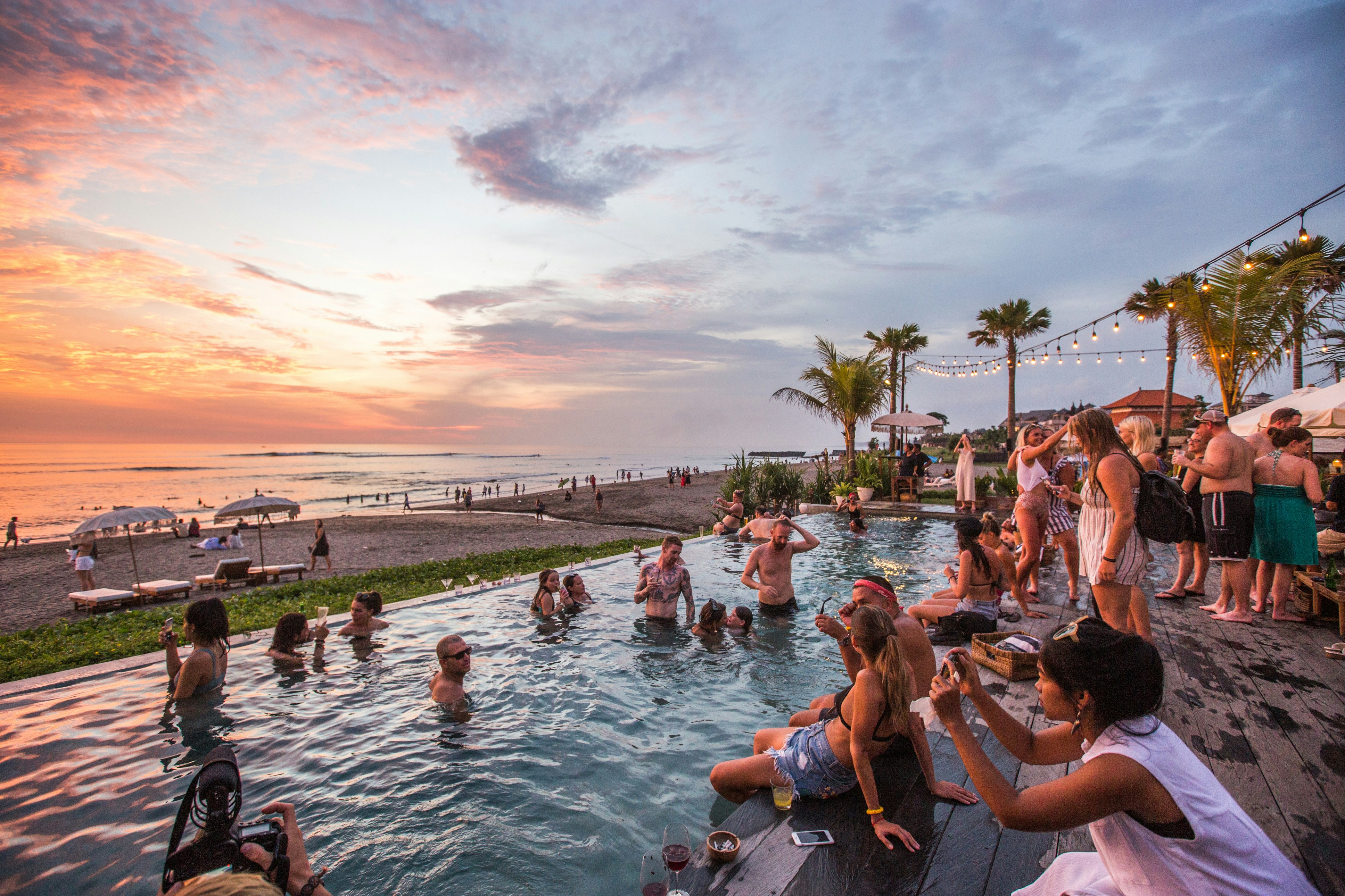 Beach club pool at sunset in Canggu, Bali