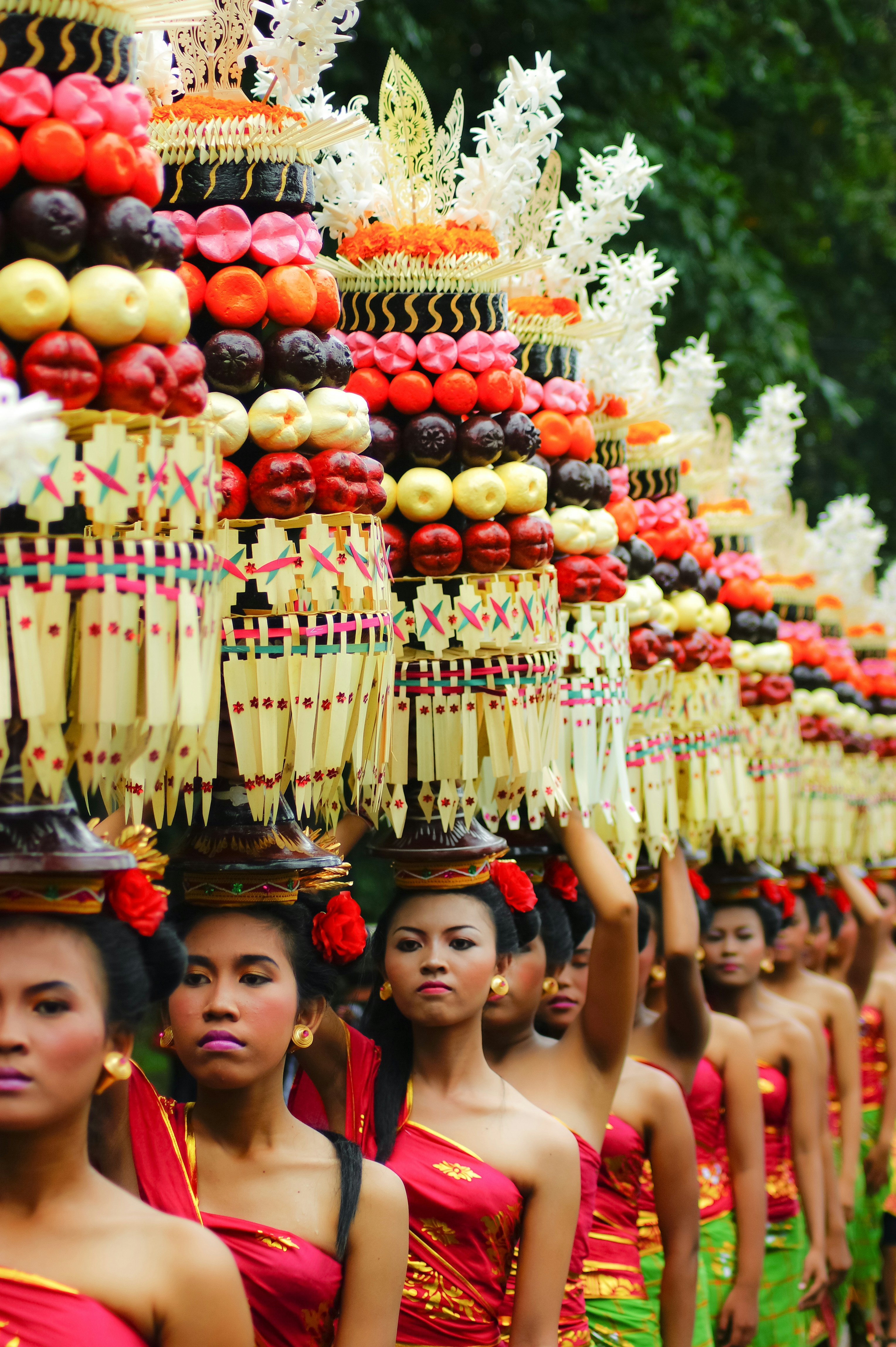 Balinese women carrying traditional offerings during a temple ceremony procession