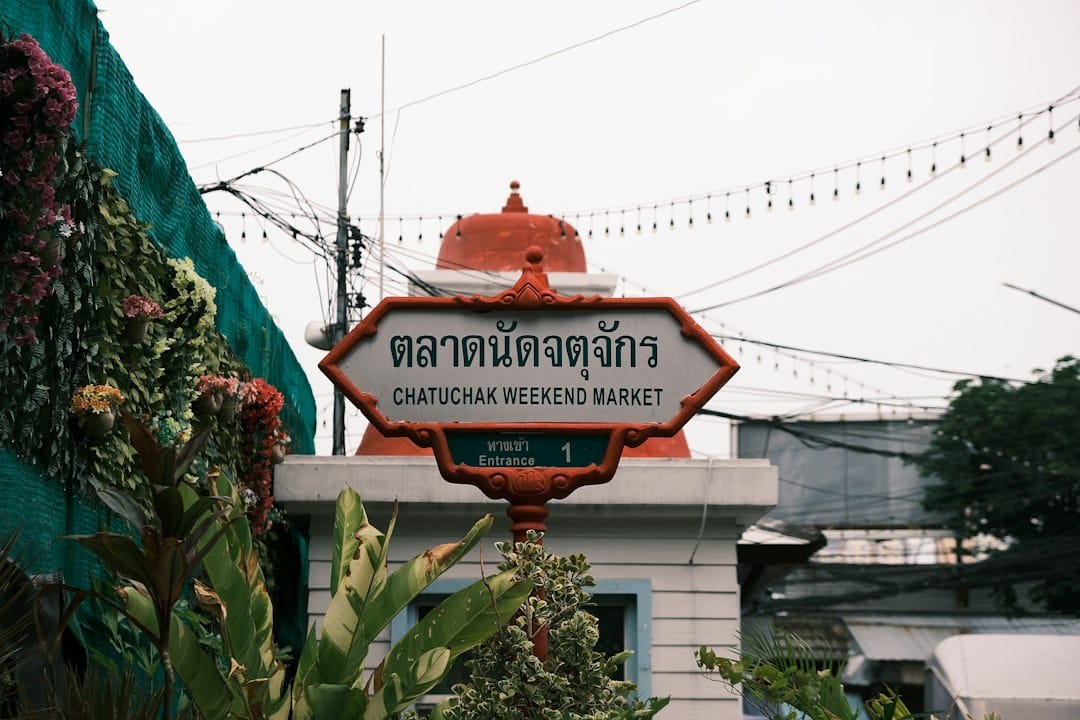 The Chatuchak Weekend Market entrance sign in Bangkok, Thailand. Photo by Pikacent on Unsplash