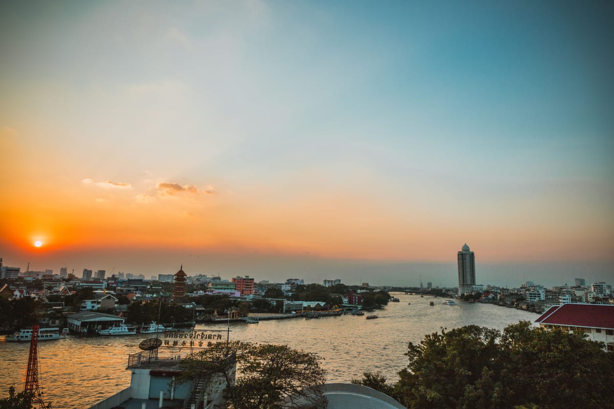 Bangkok skyline along the Chao Phraya River at sunset, Thailand