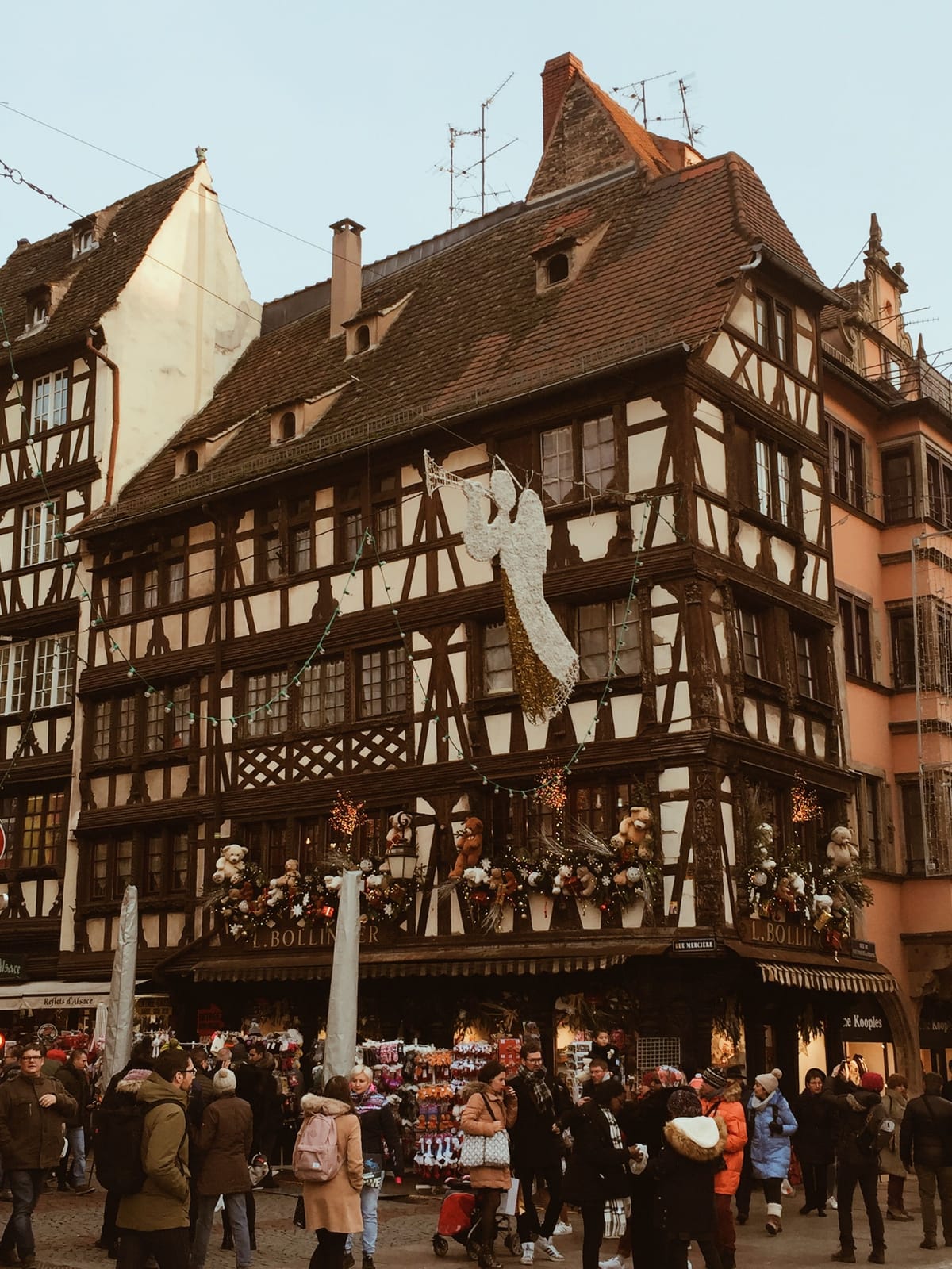 Half-timbered Alsatian building decorated with teddy bears and lights for Strasbourg's Christmas market