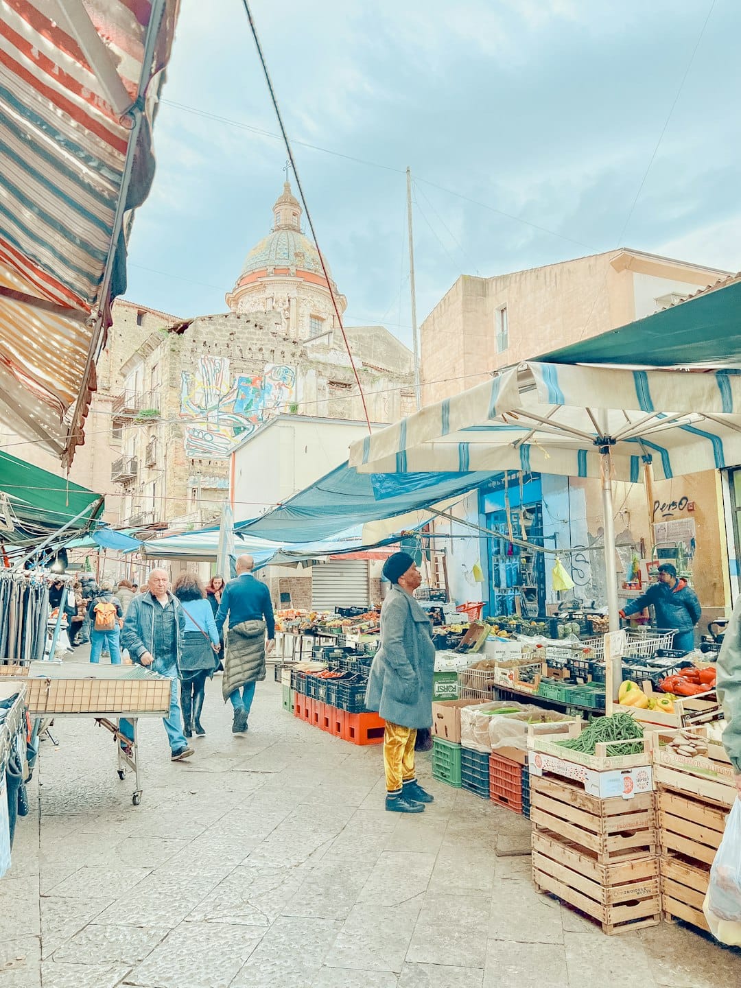 Market stalls beneath the domed Chiesa del Carmine at Ballarò Market, Palermo, Sicily. Photo by Serena Repice Lentini on Unsplash