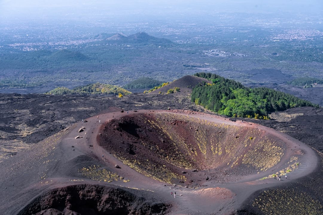 Aerial view of a volcanic crater on the side of Mount Etna, Sicily. Photo by Aron Marinelli on Unsplash