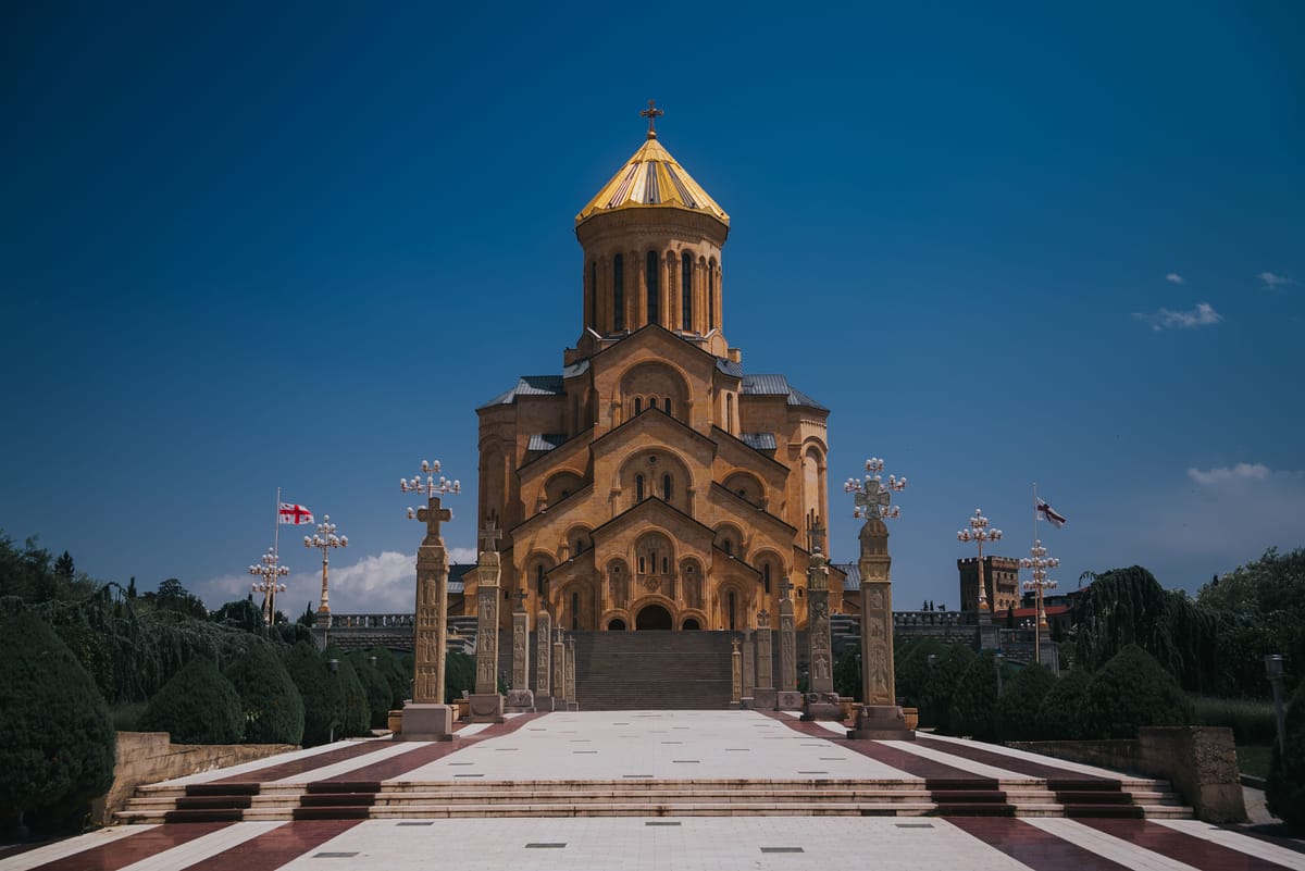 Sameba Cathedral (Holy Trinity Cathedral) in Tbilisi, its golden dome against a clear blue sky