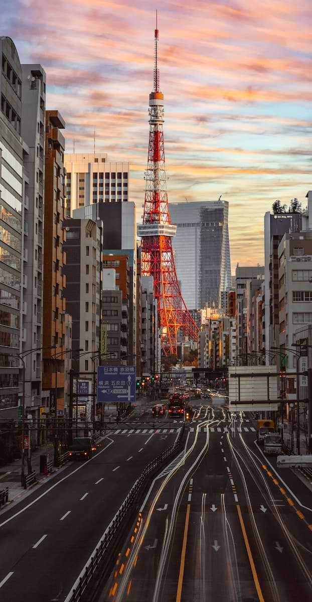 Tokyo Tower at sunset seen from a city street